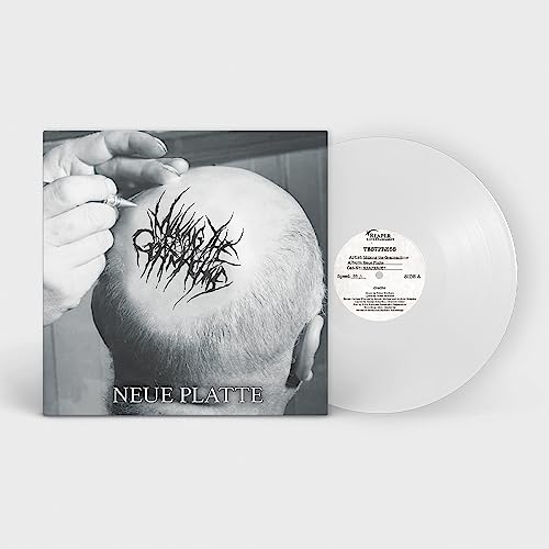 Vinyl record and album cover showing a tattooed scalp and text.