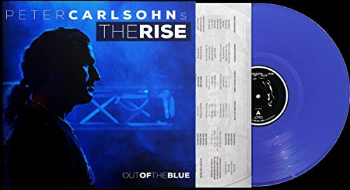 Blue vinyl record with album cover featuring a man in profile.