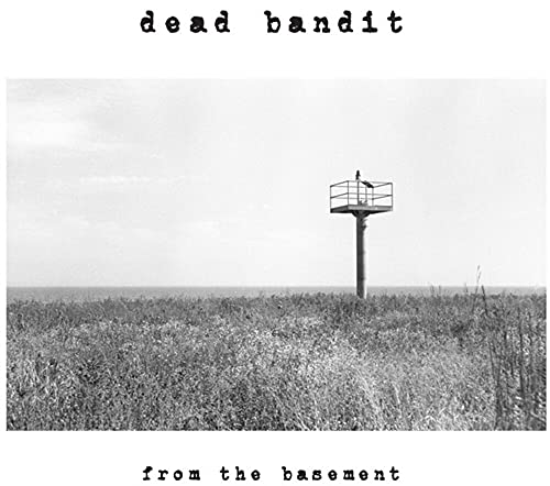 Black and white album cover with a lone water tower in a field.