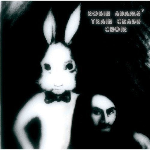 "CD cover with a person wearing a white rabbit mask and a bow tie."