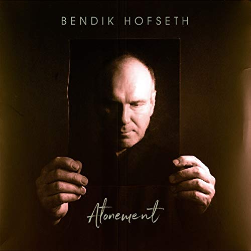 Album cover for "Atonement" by Bendik Hofseth, featuring a man holding a dark portrait.