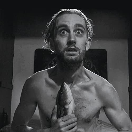 Black and white portrait of a shirtless man holding a fish.