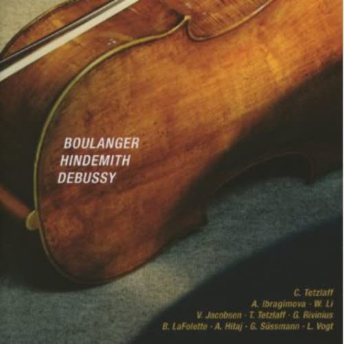 Close-up of a violin with composers’ names and performers listed.