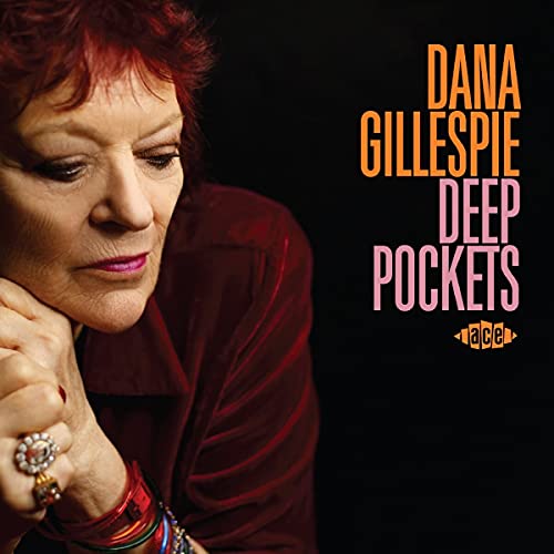 "CD cover featuring a woman with red hair and a red velvet shirt."