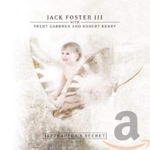 CD cover: baby with angel wings and dinosaur-patterned shadow.