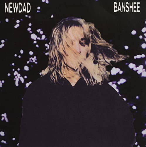 Newdad’s “Banshee” vinyl cover: blurred portrait against a speckled purple background.