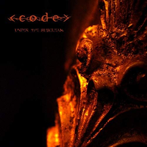 The image shows a dark, close-up of a metal object, possibly a statue or mask, with a reddish-orange glow. For the alt text: "Dark metal object with reddish-orange glow, 'code' and 'under the subgleam' text."