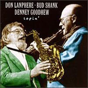 Album cover: two men playing saxophones, one in green, one in blue, against a black background.