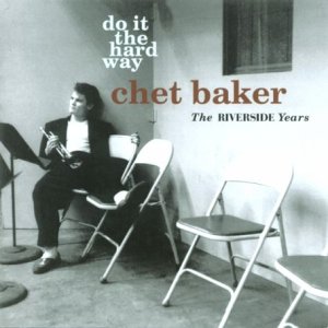Chet Baker album cover: black and white photo of man sitting with trumpet.