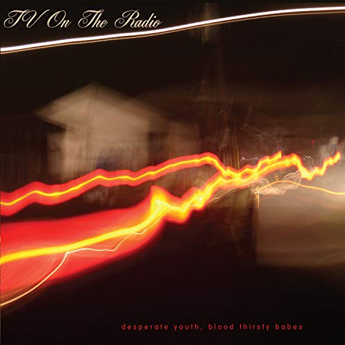 Tv On The Radio album cover: blurred lights and a dark building.