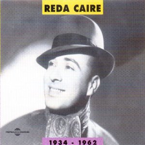 Black and white portrait of Reda Caire in a hat and formal wear.