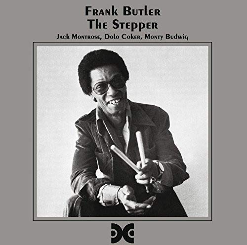 Frank Butler album cover featuring a portrait of the artist with drumsticks.