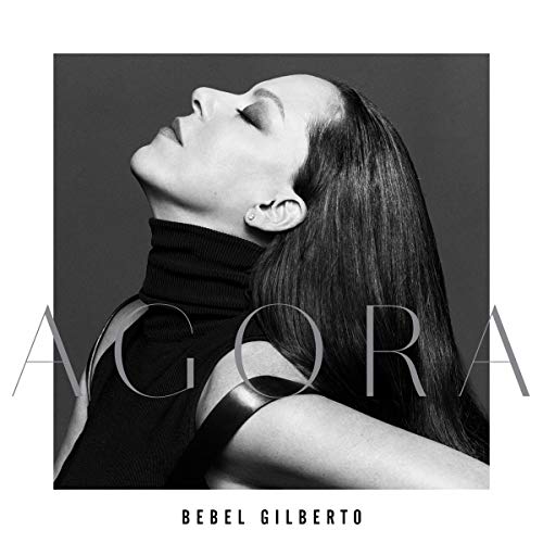 Black and white album cover featuring Bebel Gilberto looking upwards.