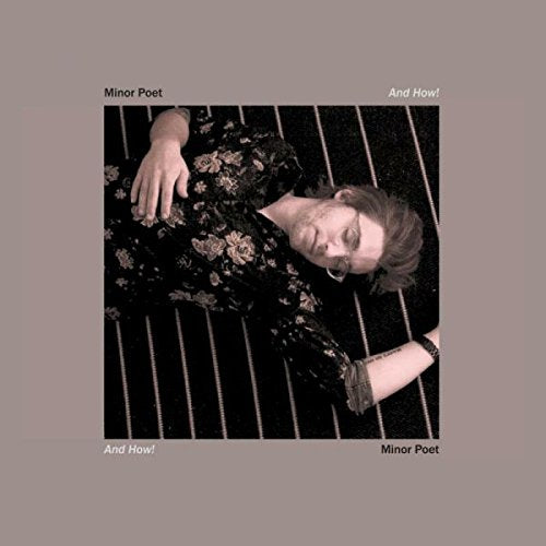 Man lying down wearing a floral shirt, album cover for Minor Poet.