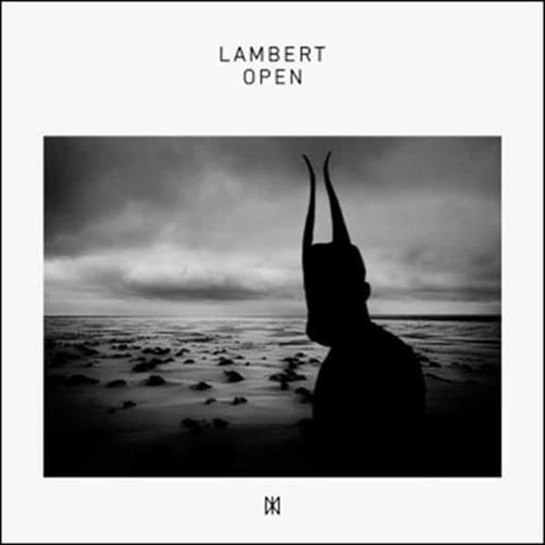 Black and white album cover with silhouette of horned figure by the sea.