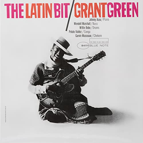 Grant Green album cover: guitarist seated, playing a guitar, pink background.