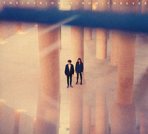 CD cover: couple standing in a columned hall, warm tones.