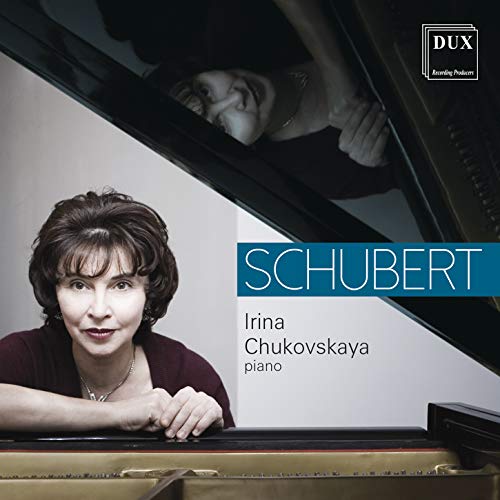 "CD cover with a woman leaning on a piano, 'Schubert' in white text on blue banner."