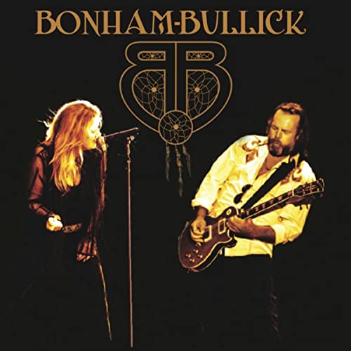 CD cover featuring a woman singing and a man playing guitar.