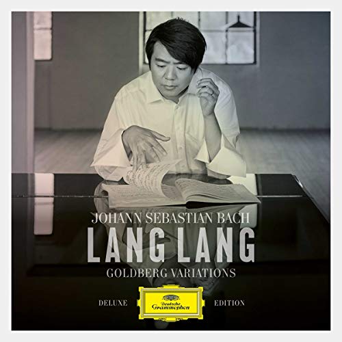 "CD cover featuring a man reading sheet music at a piano."