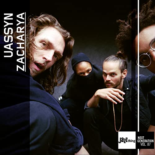 CD cover featuring three musicians with varied hairstyles and expressions.