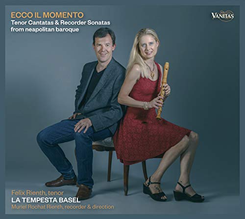 "CD cover with man and woman, she holding a recorder, against a blue background."