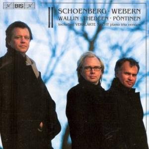 CD cover featuring three men in black coats against a blue sky background.