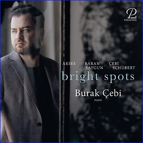 CD cover featuring pianist Burak Cebi in a grey suit, dark background.