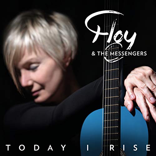 Album cover: blonde woman holding a blue guitar against a black background.