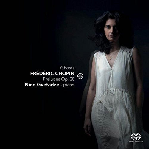 Woman in white dress standing against dark background with album title and artist information.