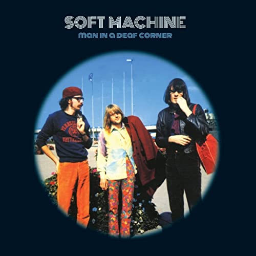 Album cover: three people standing outdoors in a circular frame.