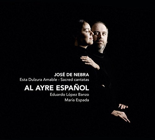 CD cover with a man and woman in black against a black background.