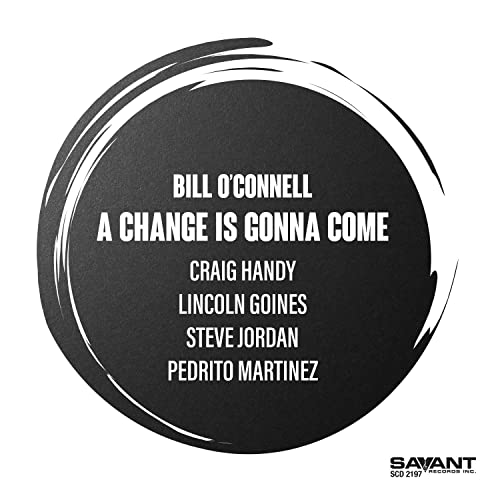 Black circle with white text: āBill OāConnell - A Change Is Gonna Come.ā