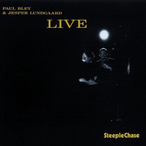 Black album cover with yellow text and a low-lit image of two musicians performing.