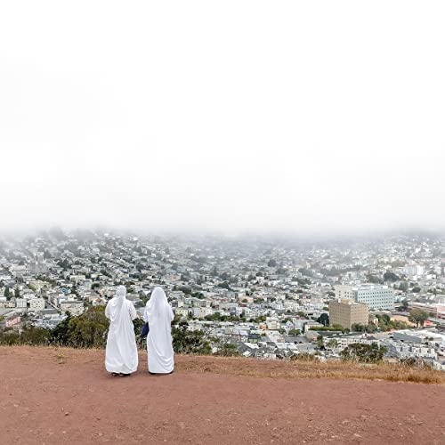 Vinyl album cover: three figures in white robes overlooking a foggy city.