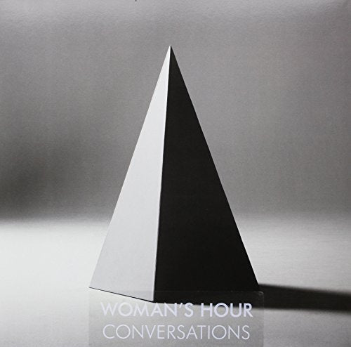 Vinyl album cover: a dark pyramid against a gray background, text below.