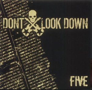Black album cover with yellow text "Don't Look Down" and skull-crossbones symbol.