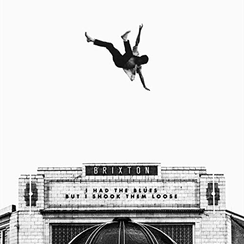Black-and-white album cover with man falling above a building with "Brixton" sign.