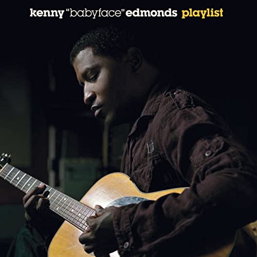 Kenny “Babyface” Edmonds holding a guitar on CD cover.