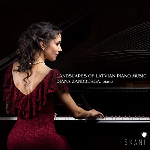 Pianist Diana Zandberga in red dress at a black grand piano.