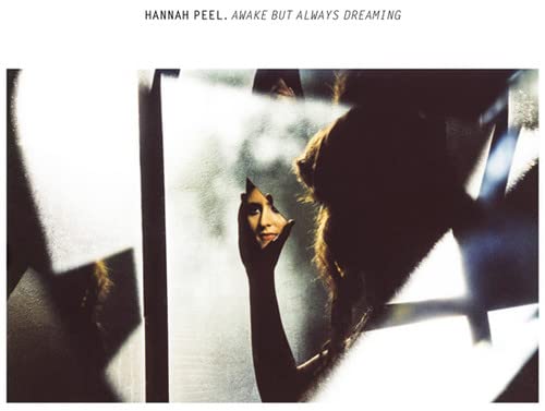 Vinyl record of Hannah Peel’s “Awake But Always Dreaming,” with dark cover art.
