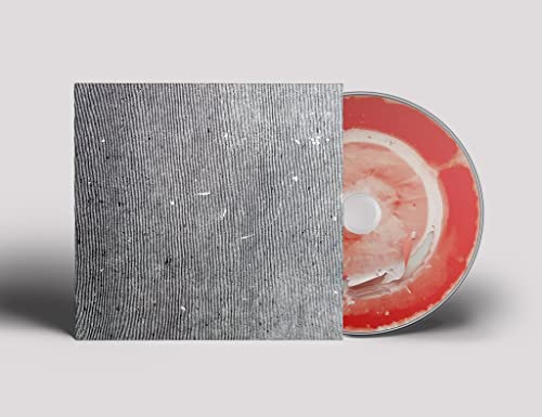 CD case with textured gray cover and partially visible red disc.