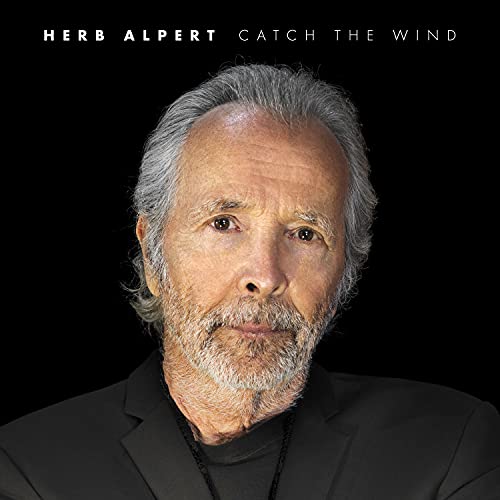 Herb Alpert's "Catch The Wind" CD cover featuring a portrait of the artist.