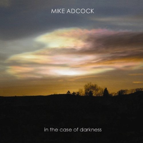 "Album cover with a serene landscape at dusk, featuring silhouetted trees and a cloudy sky."