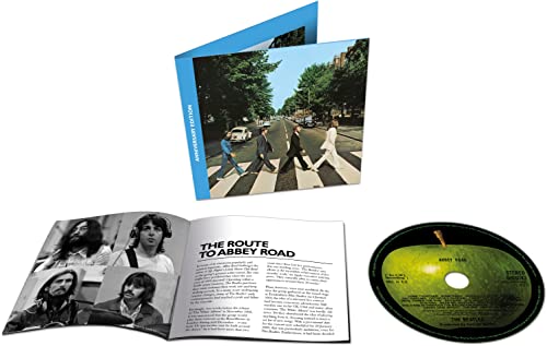 The Beatles’ Abbey Road CD packaging with album cover and booklet.