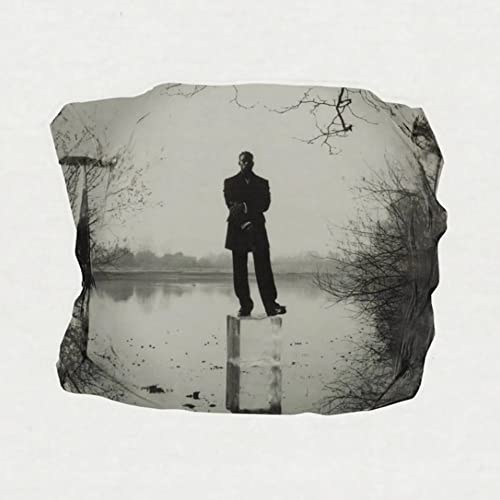 Black and white album cover featuring a man standing in a wintry landscape.