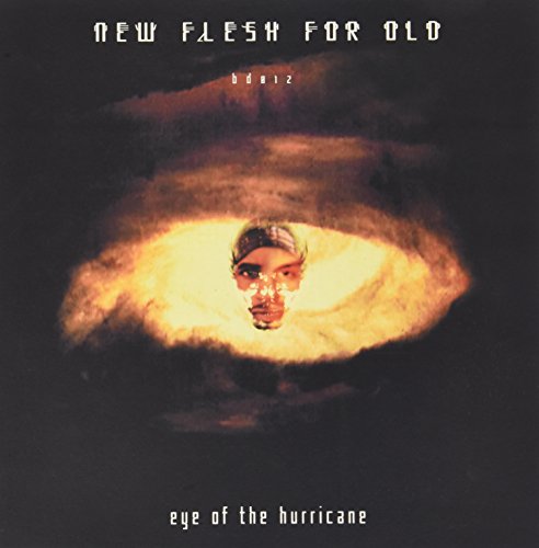 Album cover: a face within a swirling, illuminated hurricane eye.