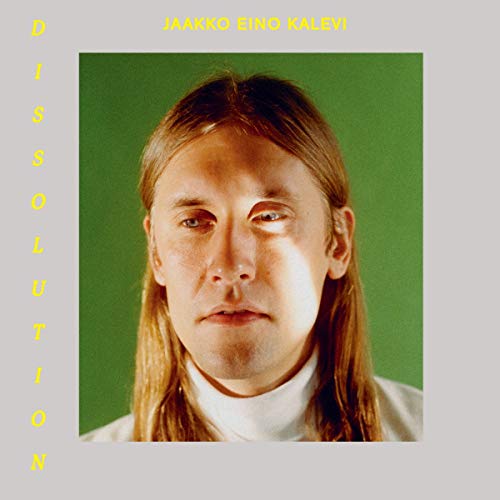 Vinyl album cover with a portrait of a man against a green background.
