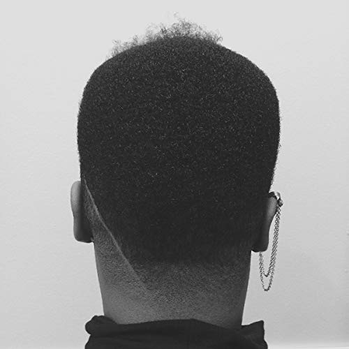 Black and white photo of the back of a person’s head and neck.