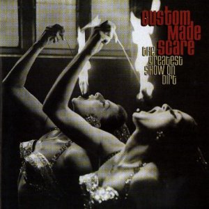 Black and white CD cover featuring two performers with flames near their faces.